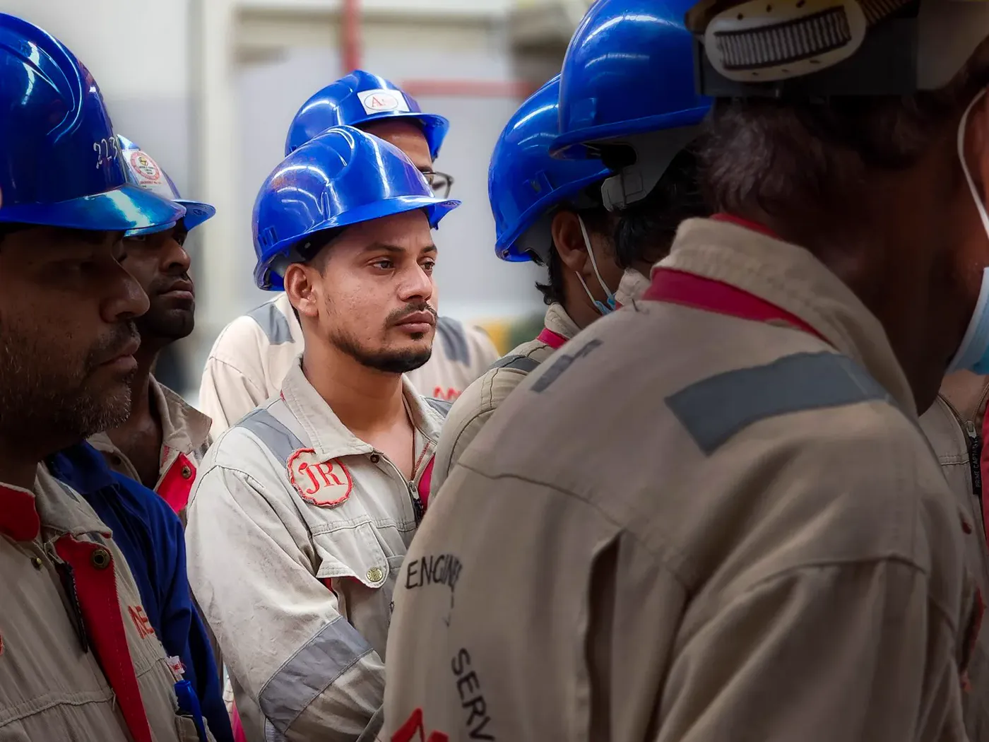 A diverse engineering group collaborating over project plans